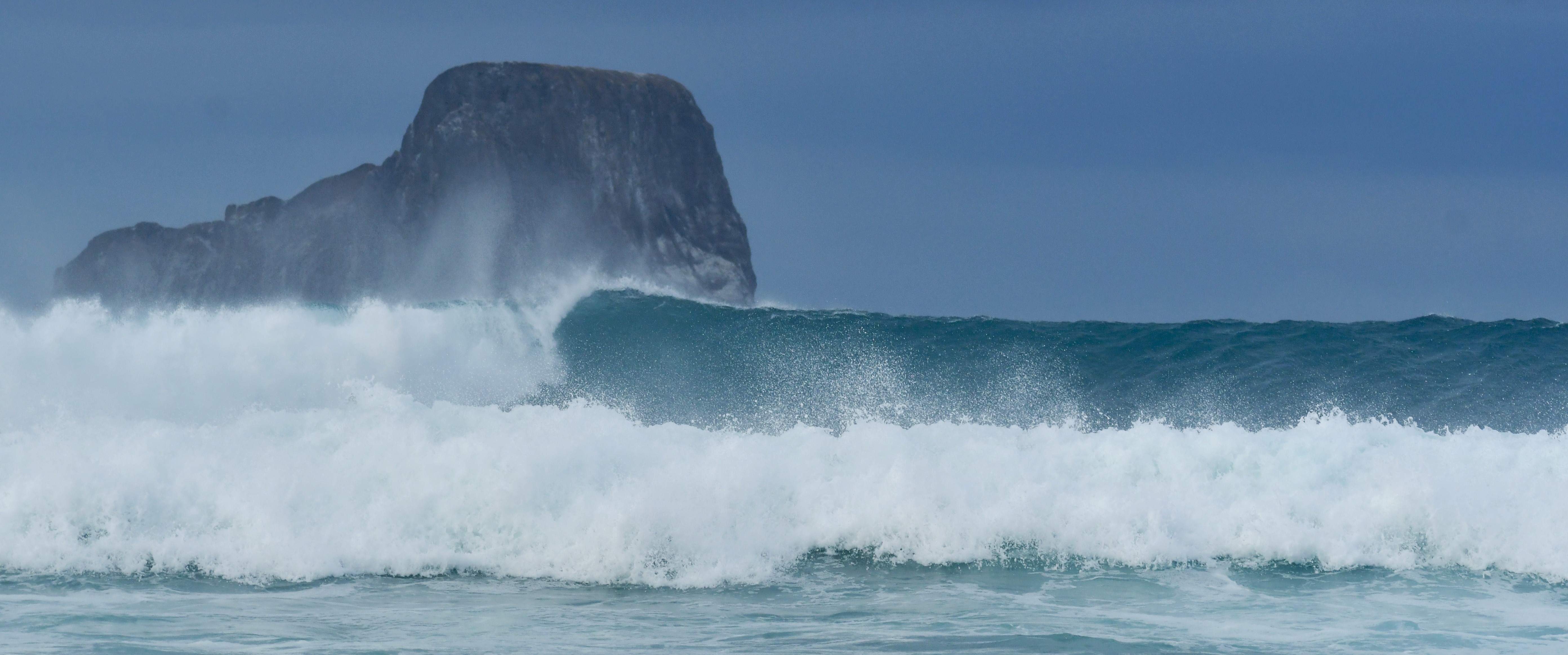 Large Galapagos wave breaking near the north coast of San Cristobal Island.